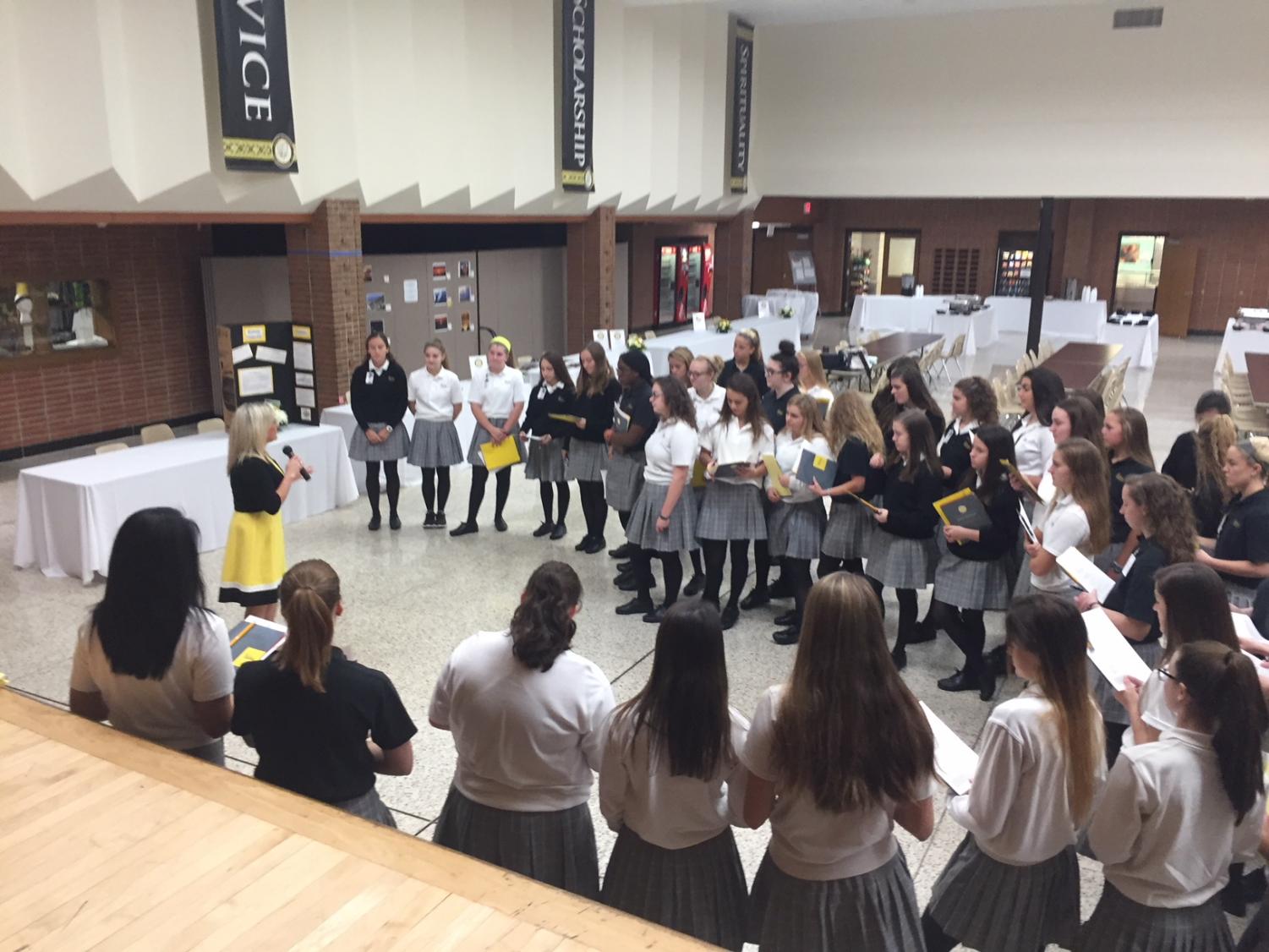 Director of Admissions, Mrs. Shana Rossi, gives student ambassadors pep talk before the start of Open House.