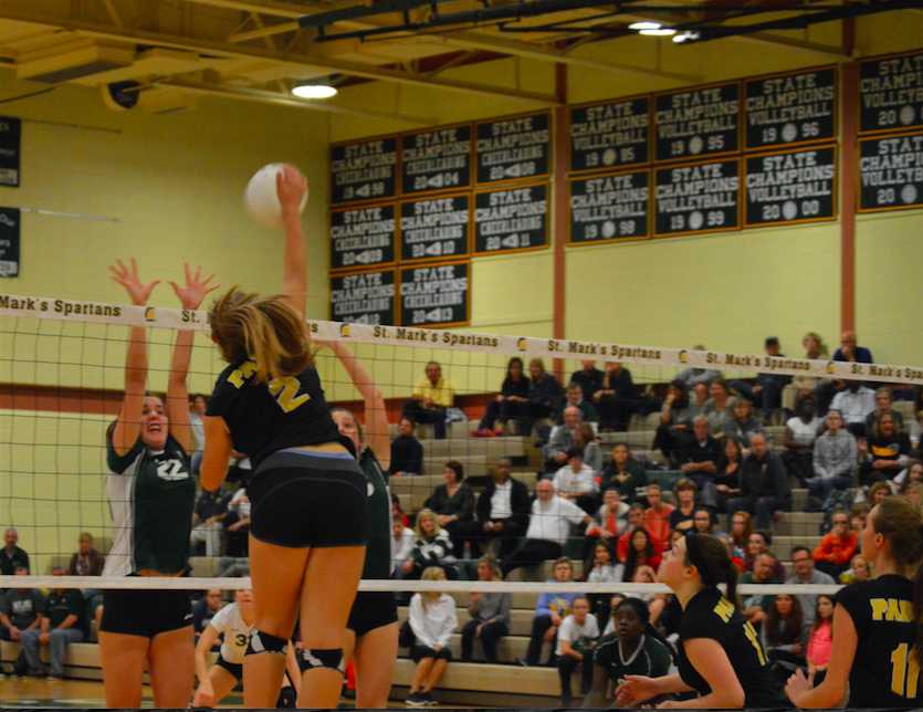 Sophomore Emily Jarome goes in for the kill, ready to beat Archmere blockers Amy Thompson and Alexis Kelly. 