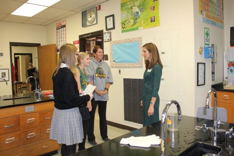 Mrs. Cambell talks to visitors in the Chemistry lab 