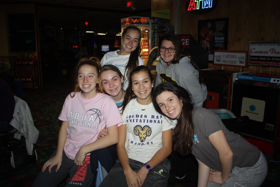 One team, Lizzy Bader, Moira Neary, Amanda Patterson, Haley Scott, Ashley Lupichuk. and Liz Baker smile for a picture.
