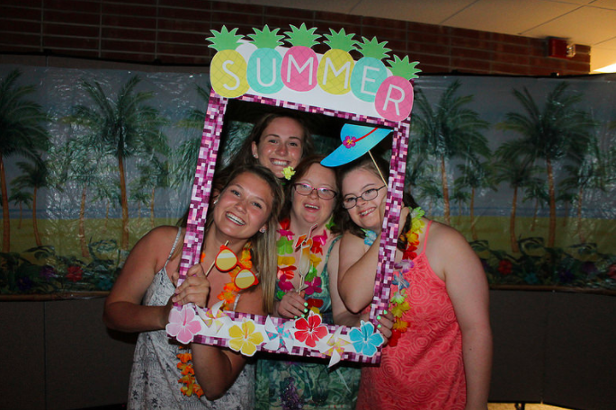 Padua students Katelyn Mcgonigal and Kathleen Melia pose for a photo booth picture at the Blue Gold Luau Prom 2017.