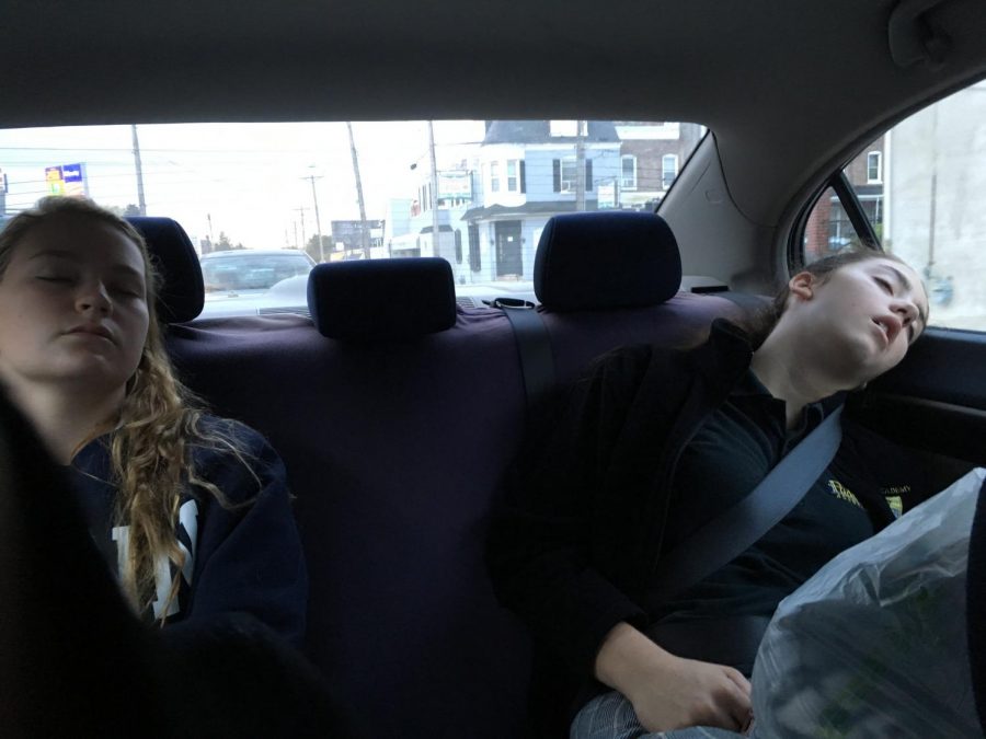 Juniors Tess Lunetta and Jess Molen sleep on the way to school. Many students find an early start to the day difficult after minimal sleep.