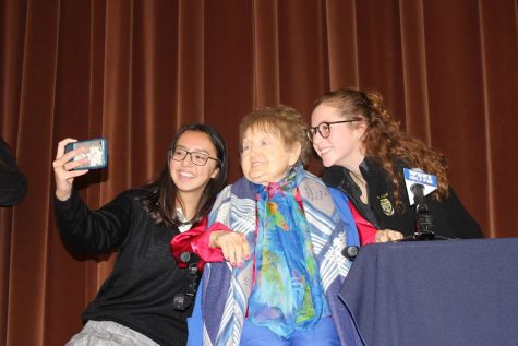 Eva Kor takes a picture with seniors Lauren Mottel and Sarah Jane Mee. Kor visited Padua on Nov. 19, 2018.