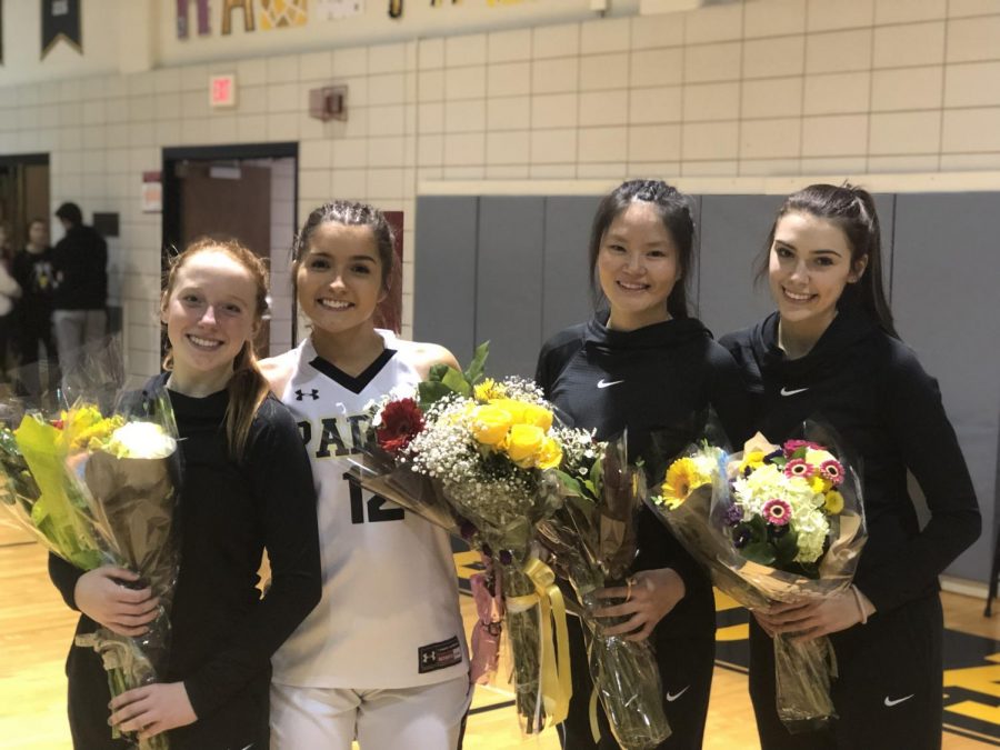 The Seniors took pictures together at their last season game.