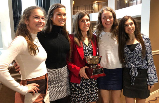 Marnie Giunta with her athletes after getting her award