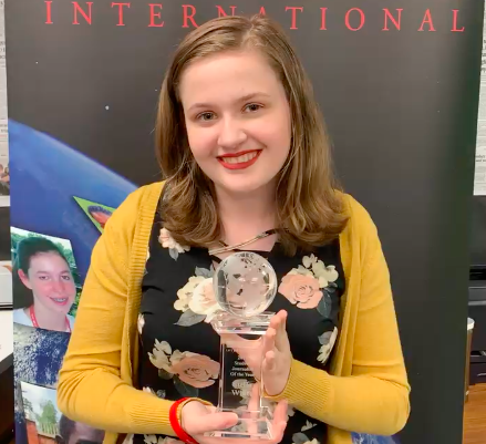 Stella White poses with her Student Journalist of the Year award, presented by Youth Journalism International.