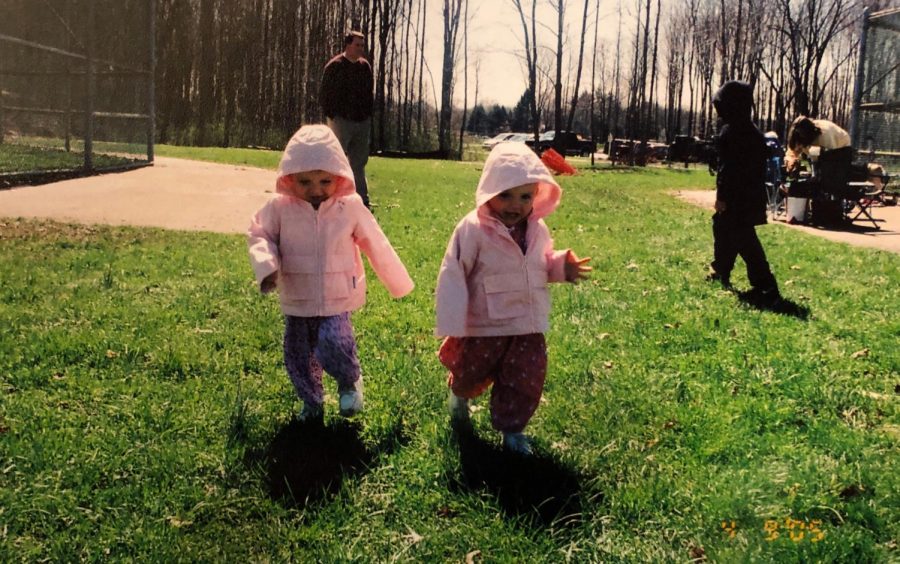 Meghan and Madison Wilhelm at the park as children. As kids, their parents used to dress them alike, as evident in their matching coats.