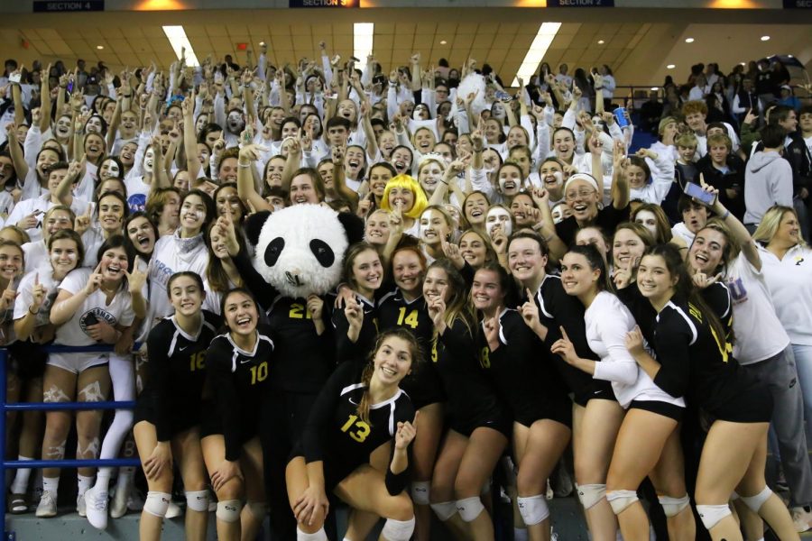 Crowd and players pose for a celebratory photograph