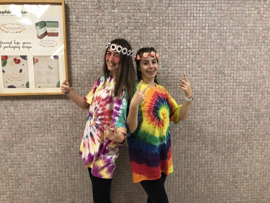 Juniors Kyla Colgan and Daniela McCourt dressed up as hippies for Halloween. Decades costumes have always been popular choices at Padua.