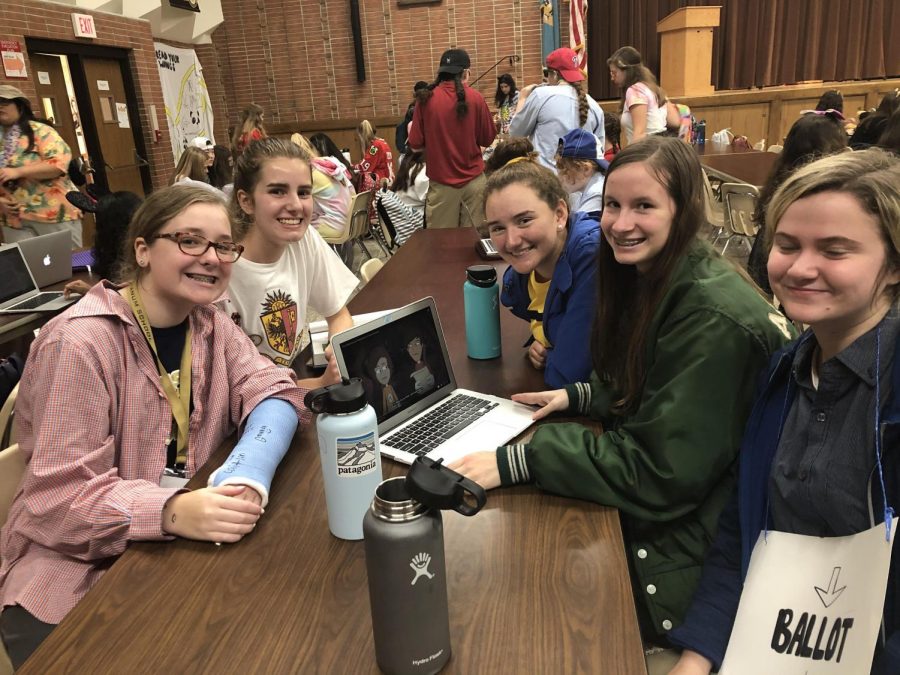 Sophomores Geneva Laur, Annie McTaggart, Elizabeth Villec, and Caitlin Kennedy (counterclockwise) in their Halloween costumes. While some students attended the parade, others chose to remain in the cafe and simply enjoy the environment. 