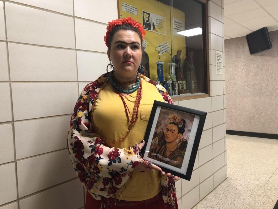 Mrs. Vintigni dressed up as Frida Kahlo for Halloween. Kahlo was a Mexican painter known for her self-portraits.