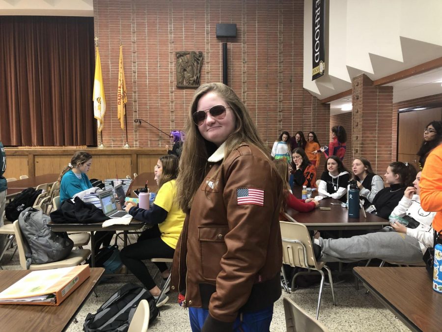 Junior Molly Shapiro dressed up as Captain Marvel. Her costume was in the style of Captain Marvels familiar blue, red, and gold suit.