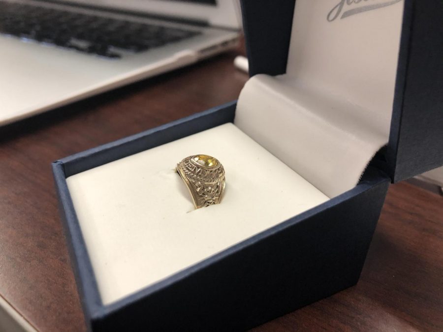 The rings from Jostens came in different sizes, colors, and embellishments. This particular ring is gold, but like the other class rings it include a yellow gemstone.