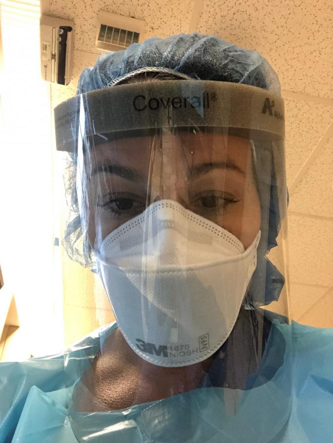 Jessica Alvarez, a respiratory therapist, wearing a N95 mask and face shield along with other protection ready for work.