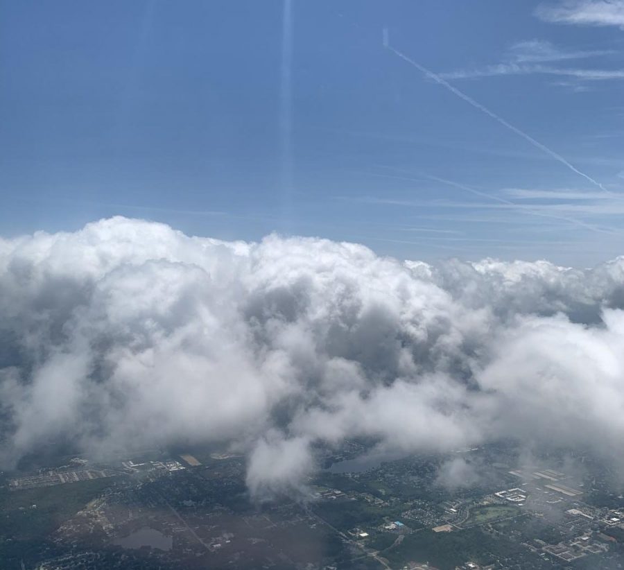 Julianna Bowen flies over the clouds on a recent flight. It was her first plane ride since 2019 due to COVID-19.