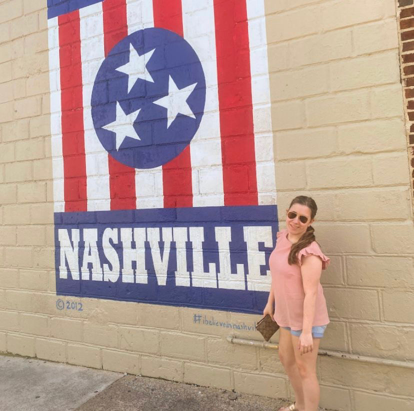 Tory Hilferty poses by mural in Nashville Tennessee. Another fun fact about her is that she loves sushi.