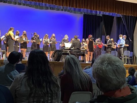 The cast of “All Together Now” sings “Human Heart” together. Ursuline senior Maggie Lober sang the lead while the other singers provided backing vocals.