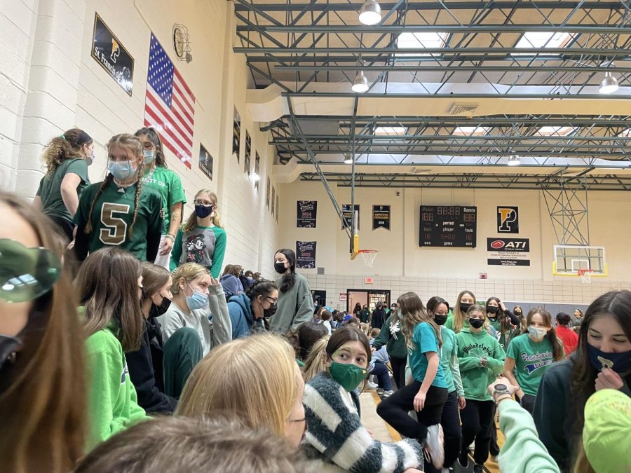 The freshmen entered the gym to participate in the final spirit assembly of the year. They wore their class color of green.