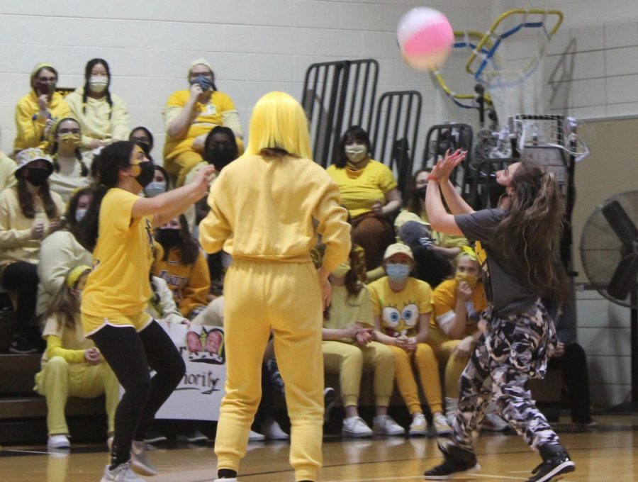 Seniors Kayla Hughes, Claire Campbell, and Erin Fitzgerald participate in a game of Keep it Up. The seniors won this round of the spirit assembly games.