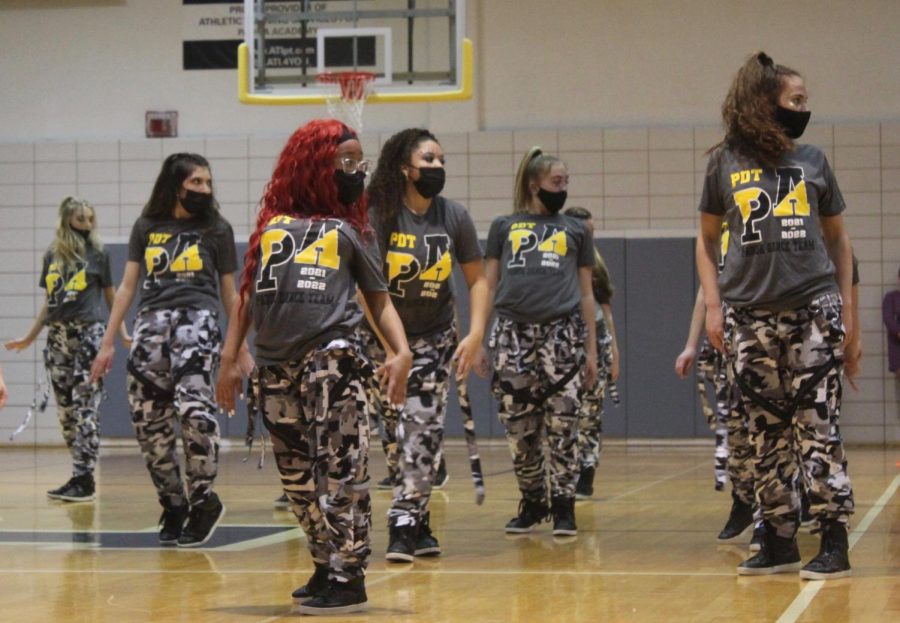 Dancers strike a pose during their opening dance. The team performed at the beginning of the spirit assembly.