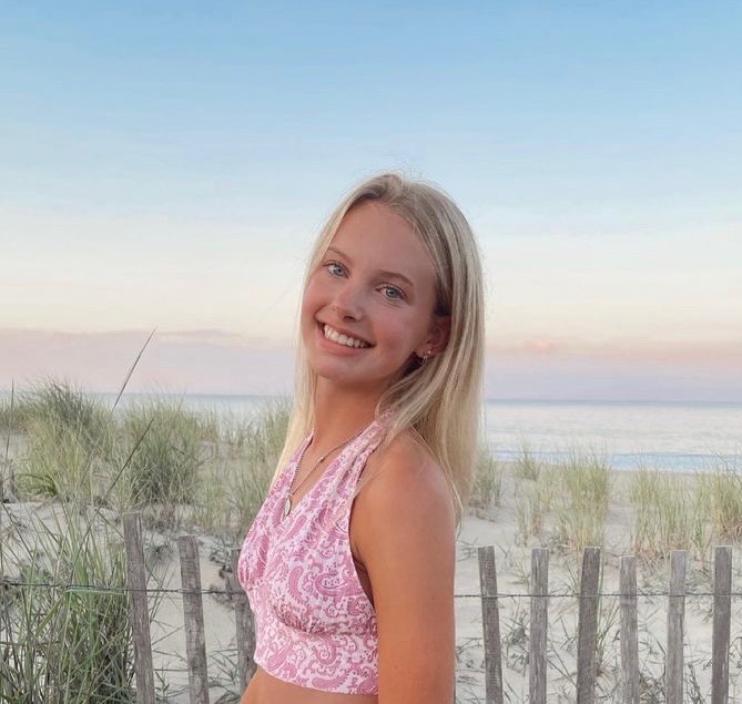 Mary Wennberg 23 poses at Dewey Beach. Wennberg is a busy student, balancing a fundraiser campaign, athletics, a job, and academics.