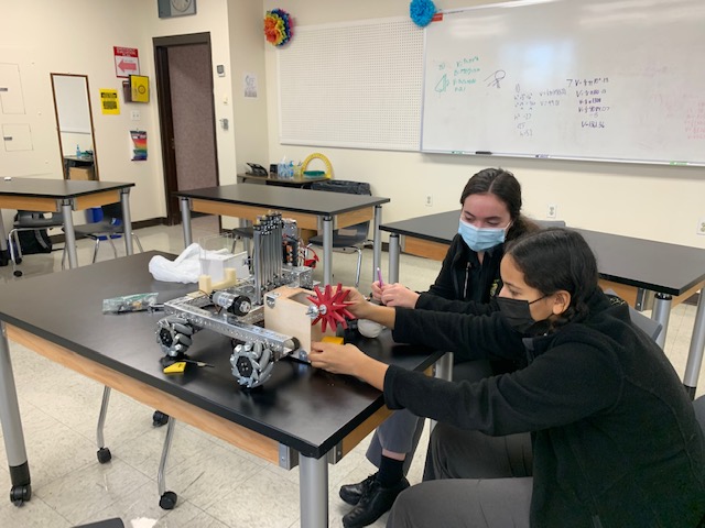 Sarah Ciocco (left) and Makeda Duey work on their robot during a Robotics Team practice. The two juniors are the only returning members of the team, so they have stepped into leadership roles.