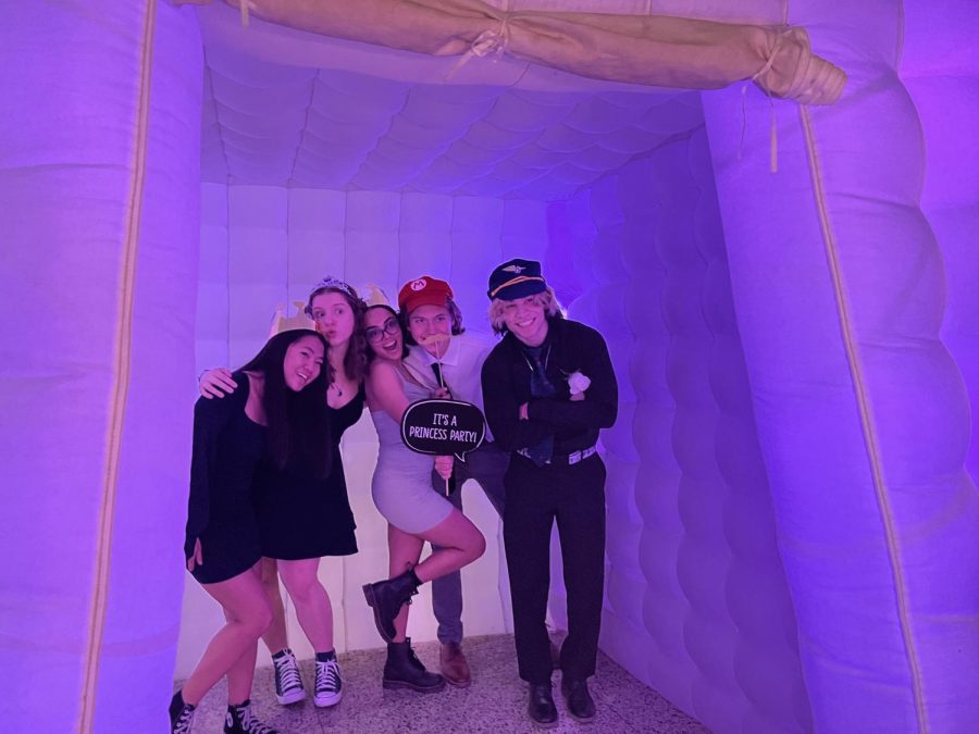 Junior Mary Mancini and her friends pose for pictures in the photo booth. “It was really nice being back at Padua for another big dance again,” she said.